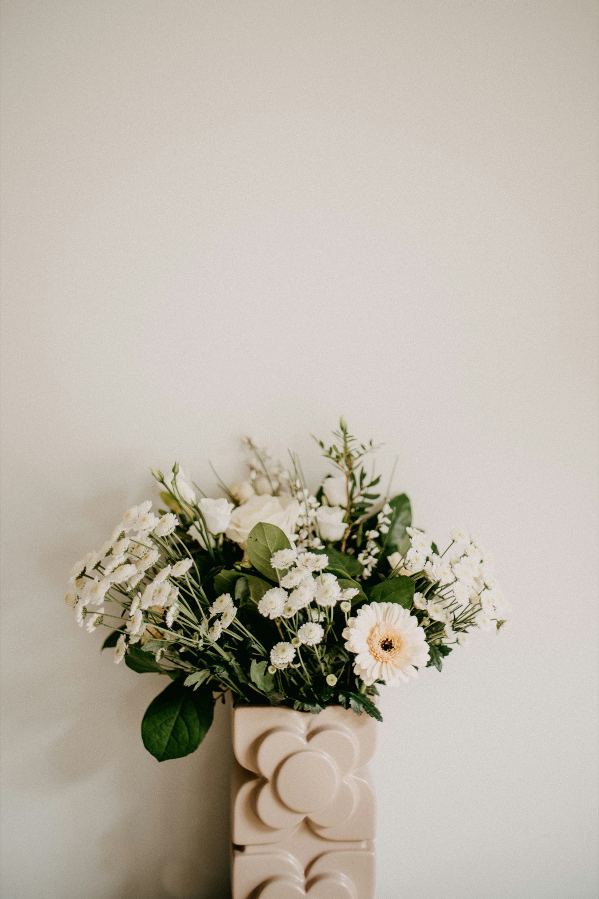 White florals in sculptural vase